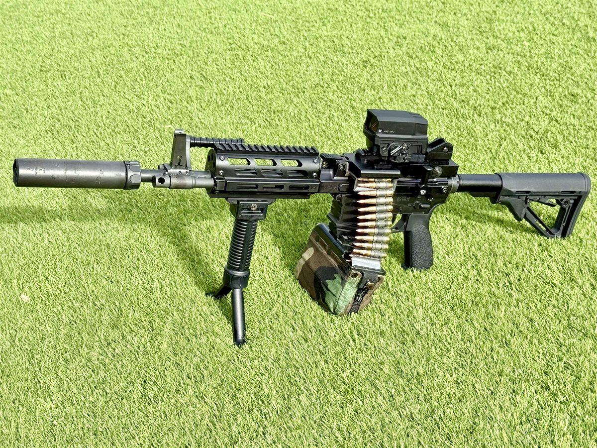 Suppressed belt-fed AR platform with red dot and bipod